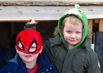 photo showing two boys at Longscroft in dressing up clothes