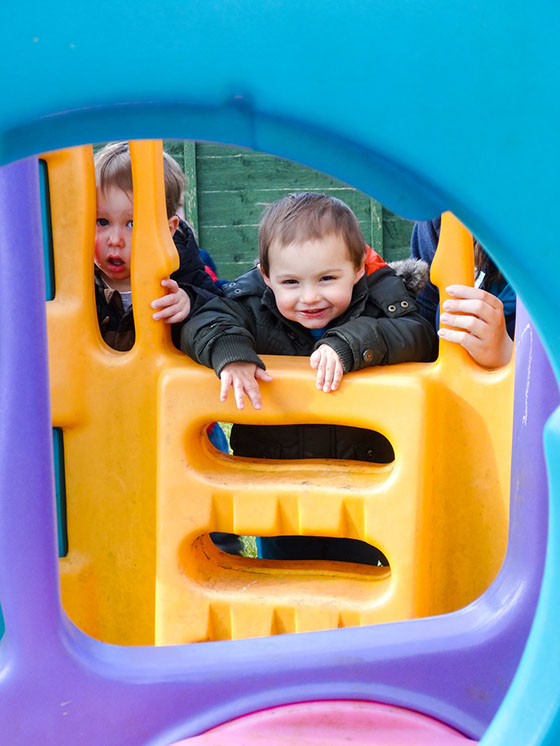 photo showing baby boys on climbing equipment at Longscroft