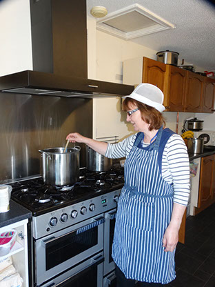 photo of staff cooking in the kitchen at Longscroft