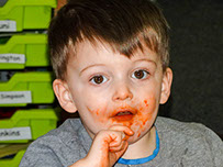 photo of a boy covered in food from Dragonflies at Longscroft
