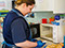 photo of staff preparing food in the Bumble Bees room at Longscroft