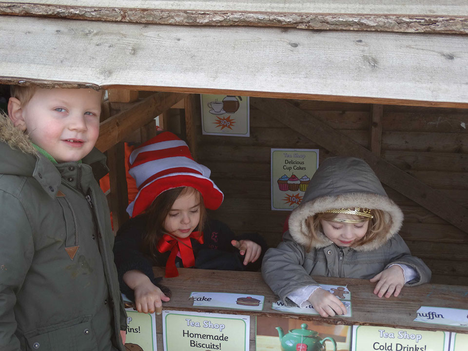 Photo showing children playing in the outdoor shop at Longscroft