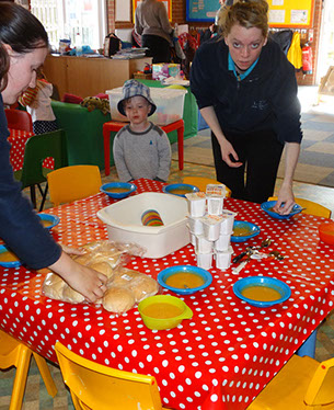 photo of staff setting the table for tea time at Longscroft