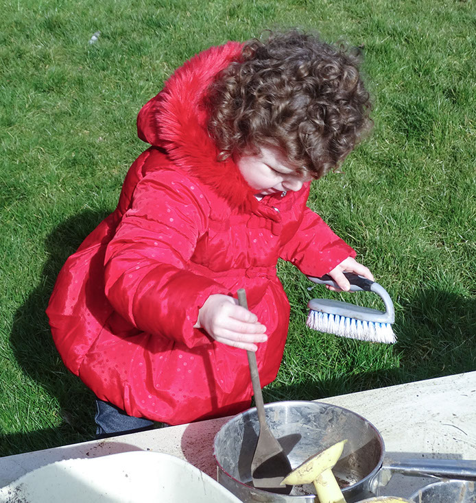 photo showing a girl play cooking at Longscroft